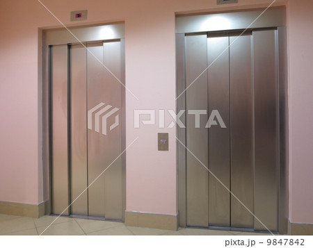 Two lifts in a hotel hall 9847842
