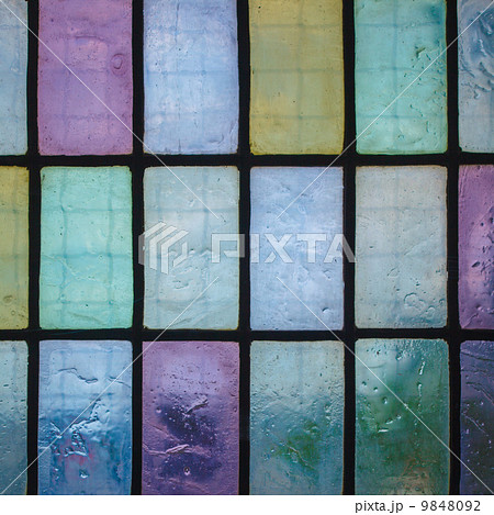 colored stained glass window with regular block pattern blue green tone colored stained glass window with regular block pattern blue green tone 9848092