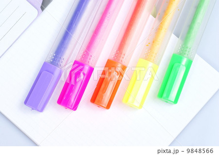 Colorful markers over a white background. 9848566