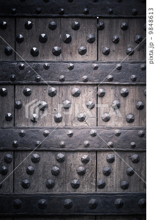 Old wooden background with metal rivets 9848613