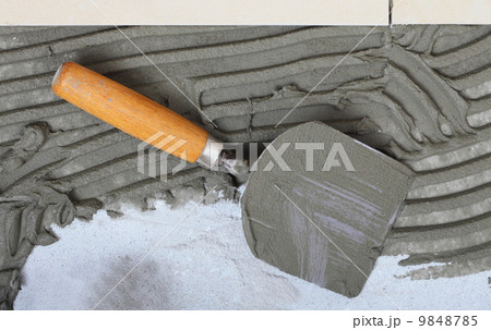 construction trowel with mortar for tiles work construction trowel with mortar for tiles work 9848785
