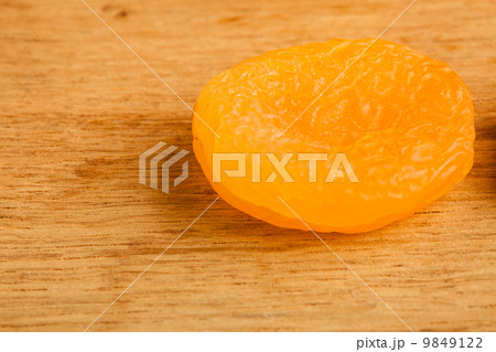 Dried apricot on wooden table background. 9849122