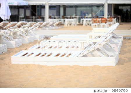 white pool chairs on sand beach white pool chairs on sand beach 9849790