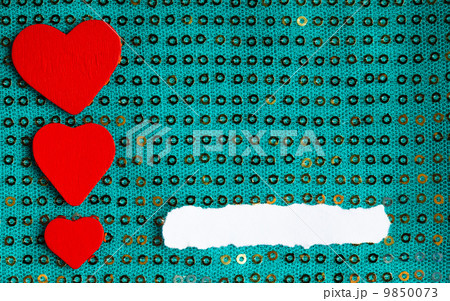 Valentines day background. paper blank hearts on green fabric material 9850073