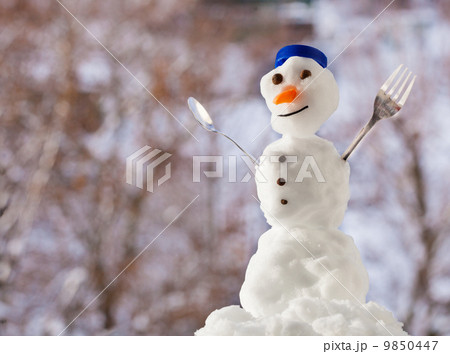 Little happy christmas snowman with fork outdoor. Winter season. Little happy christmas snowman with fork outdoor. Winter season. 9850447