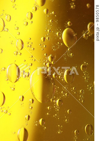 soap bubbles yellow liquid background 9850578