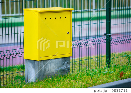 Yellow electric control box outdoor. Urban power and energy. 9851711