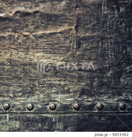 Grunge black metal plate with rivets screws background texture Grunge black metal plate with rivets screws background texture 9853462