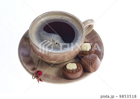 chocolate pralines cup with black coffee on white chocolate pralines cup with black coffee on white 9853518