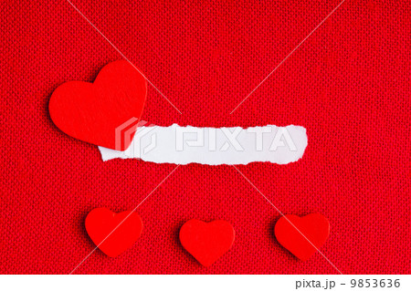 Piece paper blank copyspace hearts on red fabric textile material 9853636