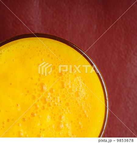 Diet healthy nutrition. Closeup of fresh yellow fruit juice in glass 9853678