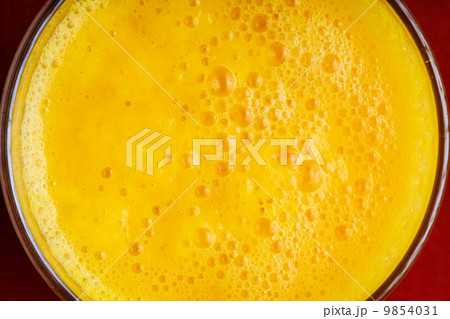 Diet healthy nutrition. Closeup of fresh yellow fruit juice in glass Diet healthy nutrition. Closeup of fresh yellow fruit juice in glass 9854031