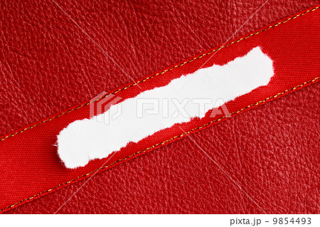 Piece scrap paper blank copy space on red leather background 9854493