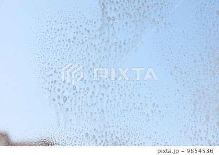 Drops on the windowpane cleaning window 9854536