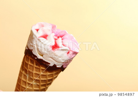 Berry icecream waffle cone on orange 9854897