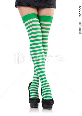 Woman legs with stockings on white 9855591