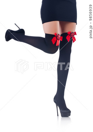 Woman legs with stockings on white Woman legs with stockings on white 9856939