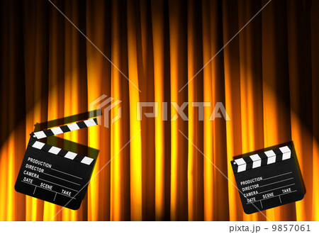 Movie clapper board against curtain 9857061