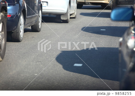 car within traffic jam in rush hour highway in city 9858255