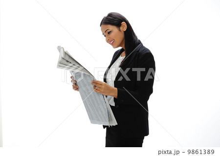 Asia Young India Businesswoman Reading A Newspaper Asia Young India Businesswoman Reading A Newspaper 9861389