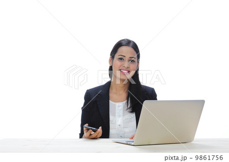 Asia Young Indian Businesswoman Sitting With A Laptop 9861756