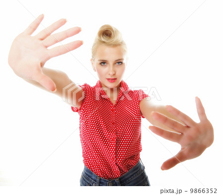 Young woman making stop gesture sign 9866352