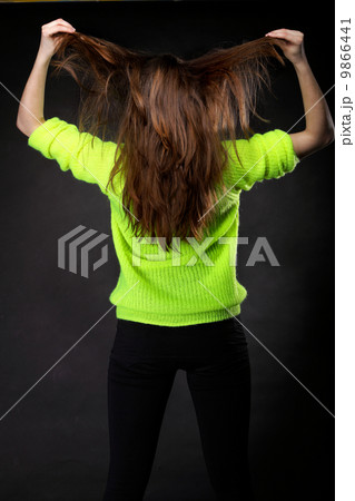 Beautiful female brown long hair back view Beautiful female brown long hair back view 9866441
