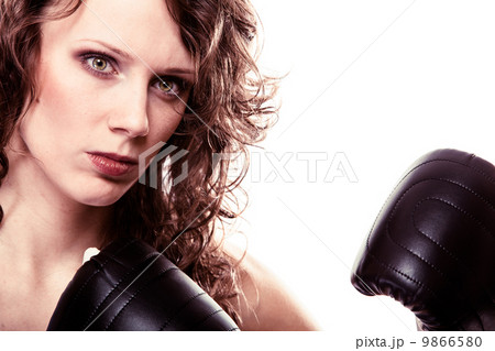 Sport boxer woman in black gloves. Fitness girl training kick boxing 9866580