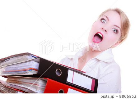 Overworked business woman with stack folder document screaming Overworked business woman with stack folder document screaming 9866852