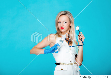 Funny sexy girl doctor nurse with syringe stethoscope 9866871