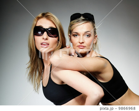 Two young sporty women after workout 9866968