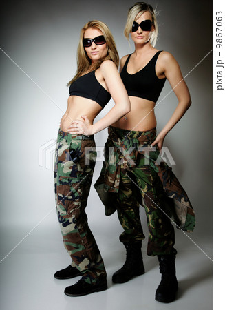 Two women in military clothes, army girls Two women in military clothes, army girls 9867063