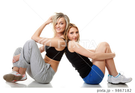 Two young sporty women after workout 9867182