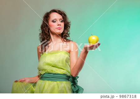 Beautiful spring woman with apple. Green concept 9867318