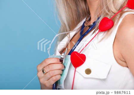 woman in nurse suit with stetoscope red heart woman in nurse suit with stetoscope red heart 9867611