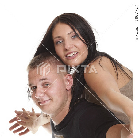 Cheerful couple having fun young smiling people embracing 9867727