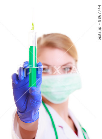 Woman in mask and lab coat. Doctor nurse with syringe. Woman in mask and lab coat. Doctor nurse with syringe. 9867744