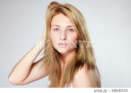 Attractive blonde woman with no make up Attractive blonde woman with no make up 9868030