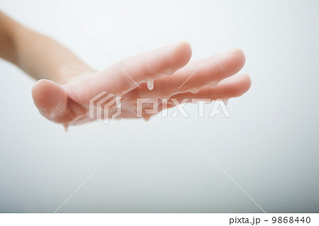 Female hand and parrafin wax bath. Manicure beauty spa salon. 9868440