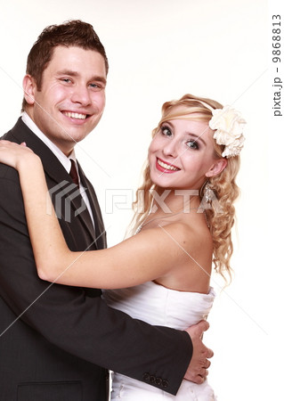 Portrait of happy bride and groom on white background Portrait of happy bride and groom on white background 9868813