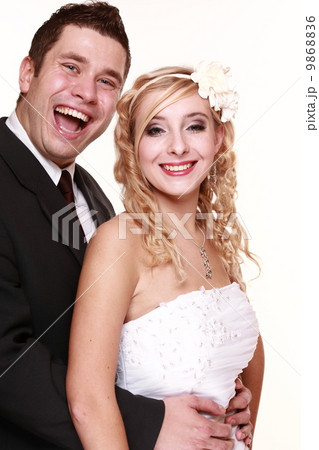 Portrait of happy bride and groom on white background 9868836