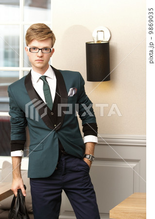 Young handsome stylish man in trendy cafe 9869035