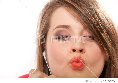 Close up funny teen girl with headphones Close up funny teen girl with headphones 9869095