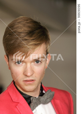 Young handsome stylish man posing indoor Young handsome stylish man posing indoor 9869096