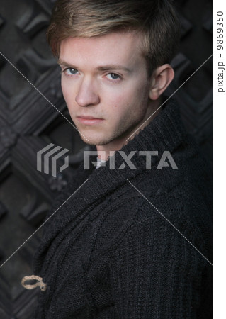 Young handsome man on street, old town Gdansk Young handsome man on street, old town Gdansk 9869350