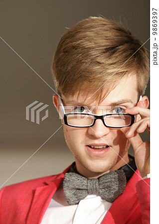 Young handsome stylish man posing indoor 9869397