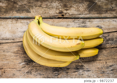 Bunch of Bananas on Grunge Wooden Background. Top View 9872237