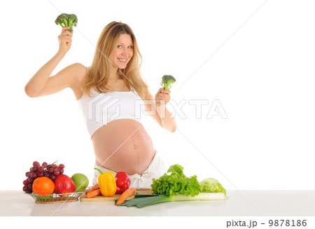 Dancing pregnant woman with fruits and vegetables 9878186