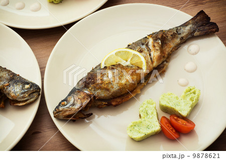 Baked fish with two hearts 9878621