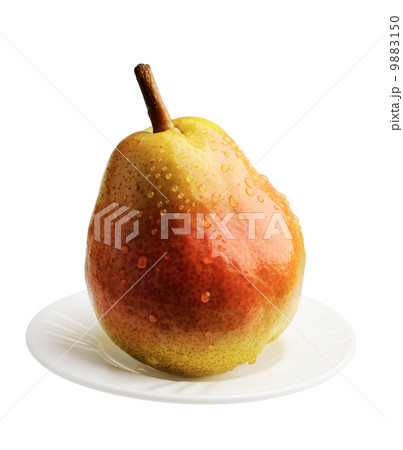 Pear on a white plate, isolated Pear on a white plate, isolated 9883150